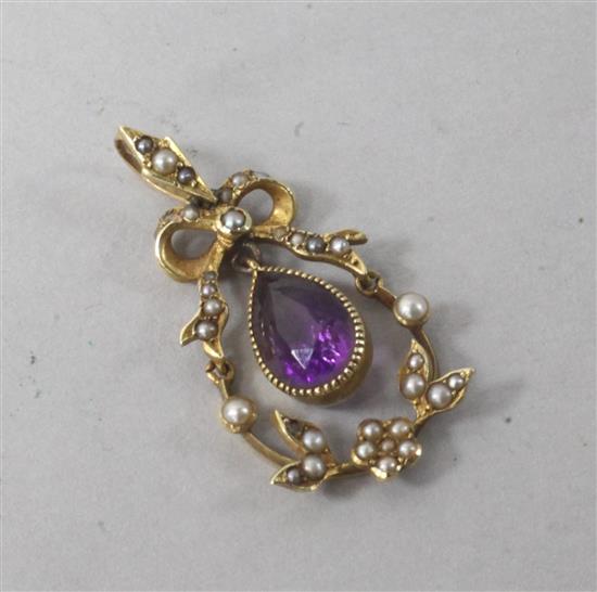 An Edwardian 15ct gold, seed pearl and amethyst drop pendant, 1.25in.